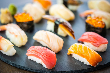 Poster - Nigiri sushi set with salmon tuna shrimp prawn eel shell and other sashimi