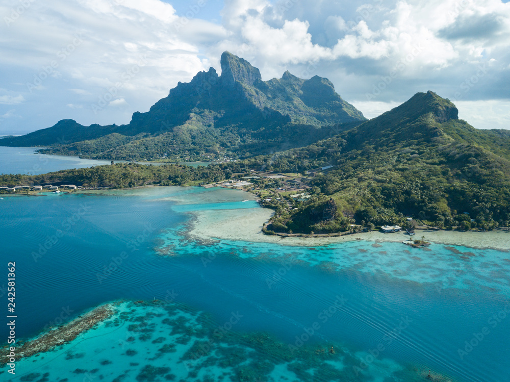Aerial image from a drone of blue lagoon and Otemanu mountain at Bora Bora island, Tahiti, French Polynesia, South Pacific Ocean (Bora Bora Aerial). - obrazy, fototapety, plakaty 