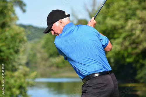 Fotografija Athletic Man Exercising With Golf Club Golfing