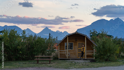 Girl Enjoying Sunset At The Cabin In Glacier National Park Buy
