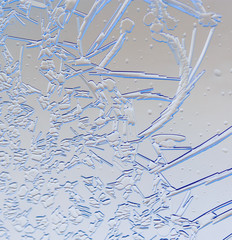 Snow patterns on glass as an abstract background