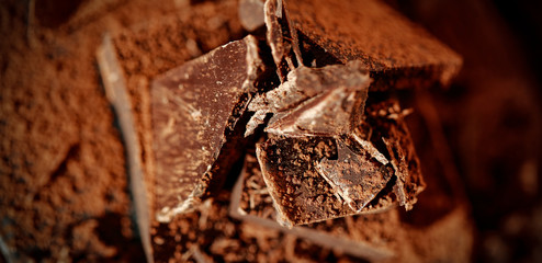 Wall Mural - Product hero shot of chocolate on wooden desk. 