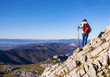 Woman Traveler with Backpack hiking in the Mountains. mountaineering sport lifestyle concept.