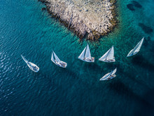 Amazing View Of Racing Sailing Boats With Small Island And Crystal Clear Water