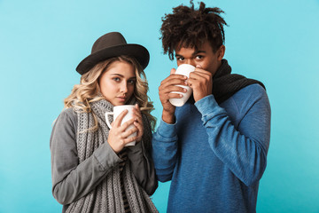 Sticker - Multiracial teenage couple wearing winter clothes