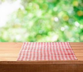 Canvas Print - Red cloth napkin on wooden background