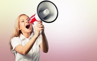 Portrait of woman holding megaphone, dressed in pin-up style