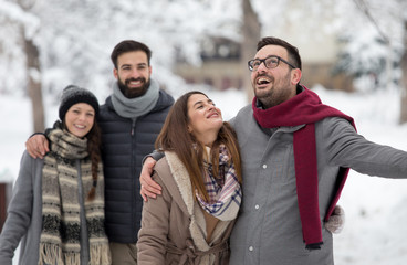 Couples walking in park on snow