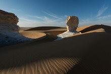 Amazing Sunset Landscape Showing White Chalk Limestone Rock Formations In The Egyptian White Desert National Park