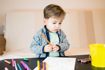 Wall Mural - Little Boy Drawing With Crayons at Home