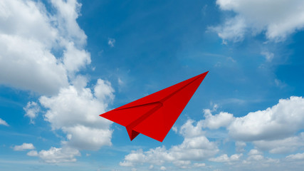 Poster - Red paper airplane flying isolated on blue sky background in education or travel concept. Mock up design. 3d abstract illustration