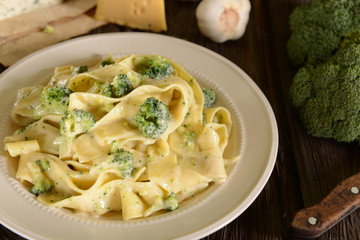 Wall Mural - Tagliatelle pasta with cheese sauce and broccoli