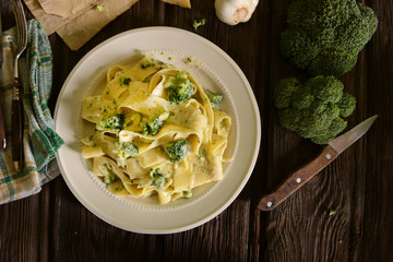 Wall Mural - Tagliatelle pasta with cheese sauce and broccoli