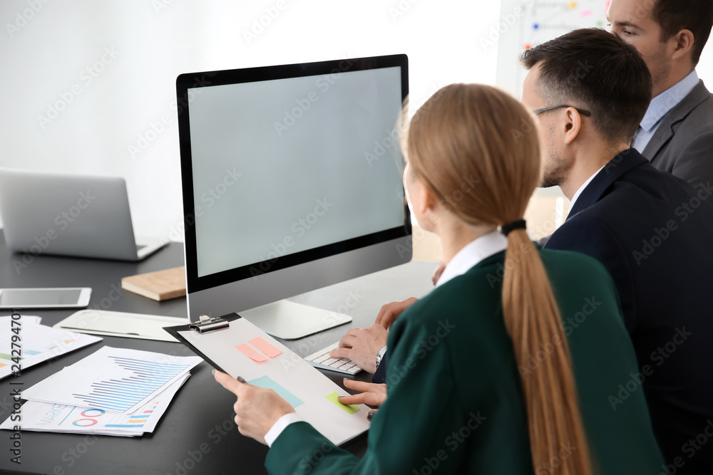 Young colleagues working together in modern office