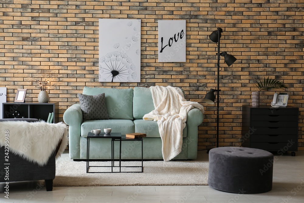 Stylish interior of living room with comfortable sofa