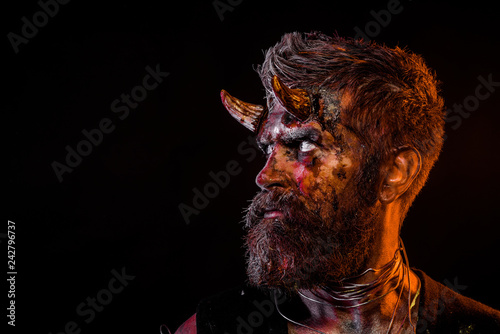 Fotografía Halloween satan with beard, red blood, wounds on face profile