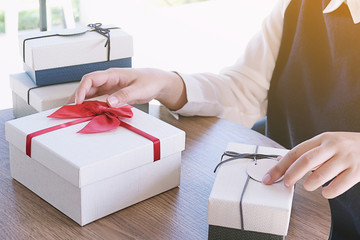 Valentine present. Gift box and red ribbon for romantic couple.