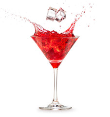 ice cubes falling into a splashing red cocktail isolated on white