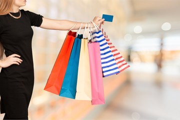 Poster - Close up woman hand with many shopping bags and credit card