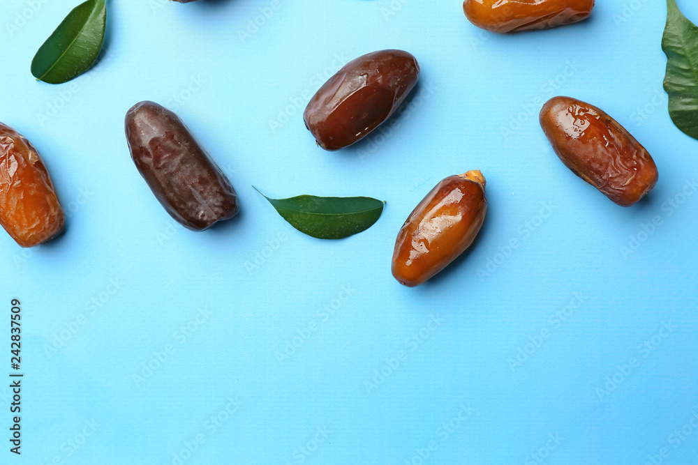 Sweet dried dates on color background