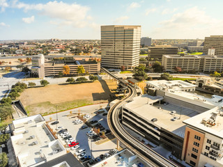 Aerial view downtown Las Colinas, Irving, Texas and light rail system (Area Personal Transit, APT). Las Colinas is an upscale, developed area in the Dallas suburb