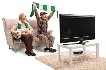 Sticker - Senior female and male soccer fans cheering with a scarf and watching a game