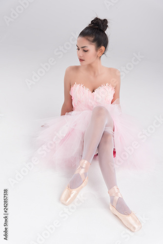 Beautiful Young Woman Ballerina Sit On The Floor Tried And Boring