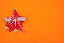 A Red Star On An Orange Background