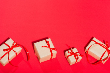 gifts on a red background many lies isolate with a red bow surprise surprise postcard place for text frame to give