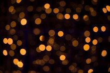 Bokeh Golden Blurred Background. Abstract Creative Yellow Bokeh Background