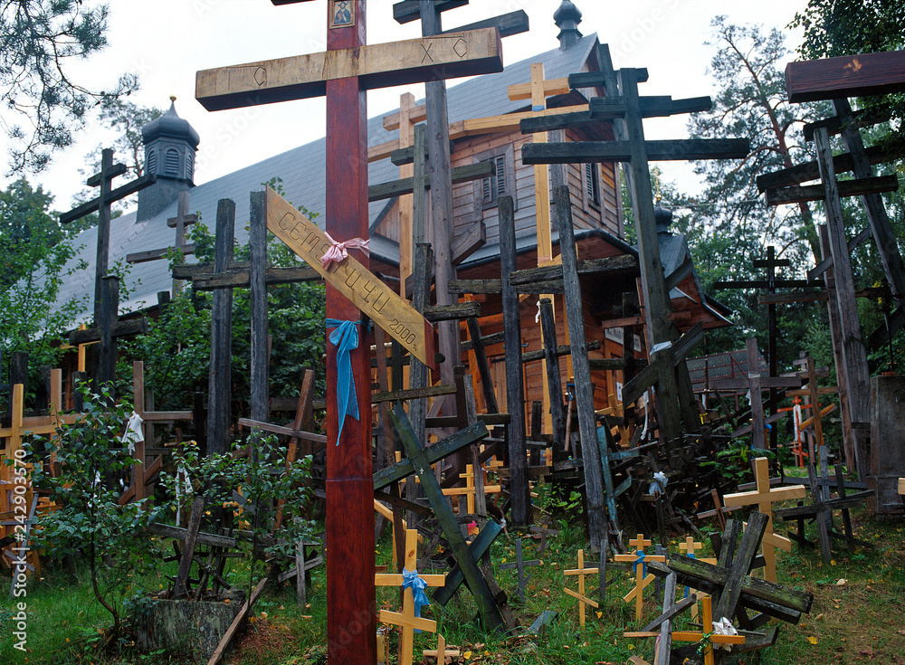 Grabarka, Orthodox crosses brought by pilgrims to the Holy Mount of Grabarka. Podlaskie Voivodeship. Polish Orthodox pilgrimage center. - obrazy, fototapety, plakaty 