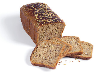 Loaf and pieces of bread with different seeds