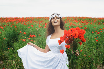 Wall Mural - Beautiful woman in field with a lot of poppy flowers