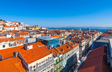 Wall Mural - Aerial skyline view of Lisbon old town, Portugal. Alfama district and Tagus River on the background