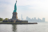 Fototapeta Nowy Jork - The statue of liberty with Manhattan in the background, New York, United States