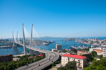 Wall Mural - Russia, Vladivostok, July 2018: View of Golden Bridge over Golden Horn Bay of Vladivostok