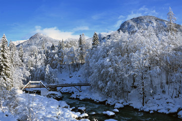 winter landscape bridge over the water in lofer pinzgau austria