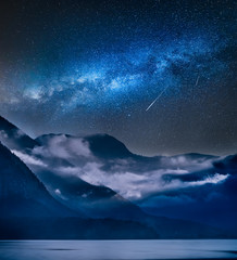 Wall Mural - milky way over fogged mountains in the morning