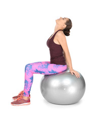 Poster - Young beautiful woman with ball doing exercise on white background. Home fitness