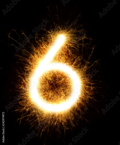 Number 6 drawn with spaklers on a black background Poster Mural XXL