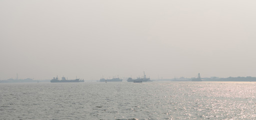 Air pollution at the pier. Bad air quality filled with dust causes of respiratory diseases. Global warming from air pollution problem. Environmental problem from gas carbon monoxide and dust. PM 2.5