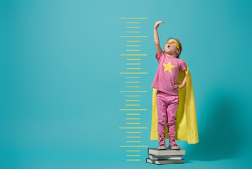 child playing superhero
