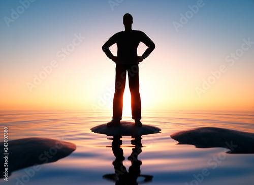 Mann in Hero-Pose im Sonnenaufgang