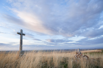 Crossings of stone representative of the Holy Week with background at dusk.