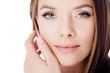 © Ulia Koltyrina - Skin care. The girl touches her face, close-up. Portrait of young beautiful woman with smooth and healthy skin