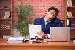 © Elnur - Young handsome lawyer working in his office