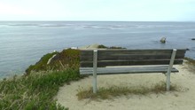 A Bench Overlooks The Pacific Coast In Monterey