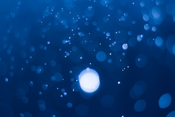 abstract deep blue background with blur bokeh light effect
