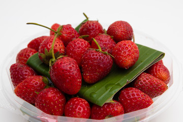 Fresh Red Strawberries on white plate on white background