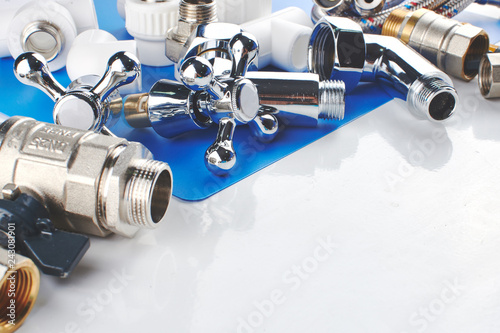 Cuadros en Lienzo Plumbing parts, accessories and tools on a blue white background.